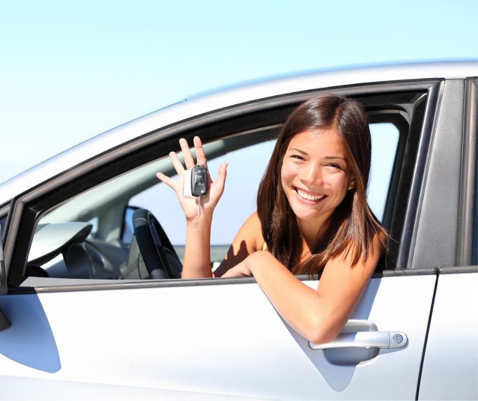 Girl Holding A Car Key — Lakeland, FL — Family Insurance Centers