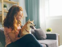 Woman Hugs a Dog at Home — Lakeland, FL — Family Insurance Centers